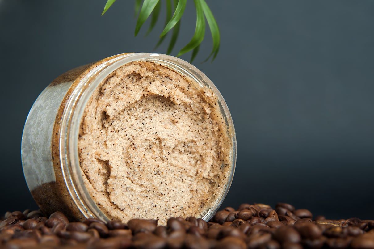 Coffee Body Scrub and Coffee Beans on Dark Background